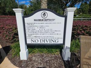 a sign that says no driving in front of a garden at Theme Park Gateway! in Kissimmee