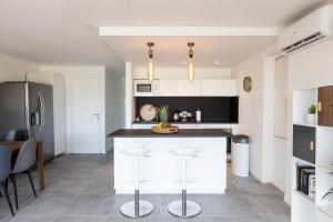 Kuchyň nebo kuchyňský kout v ubytování Baie Nettle Beach Villa 1130
