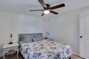 a bedroom with a bed with a ceiling fan at Retreat for 2 @ Lake Talquin in Tallahassee