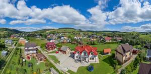 an aerial view of a small village with houses at Willa u Alicji i Jana in Tylicz