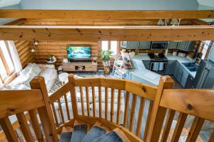 an overhead view of a living room and kitchen in a log cabin at Cozy Cabin Inn in Owen Sound