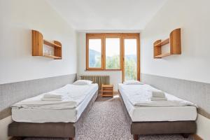 Posteľ alebo postele v izbe v ubytovaní Ośrodek Wczasowy PANORAMA Szczyrk