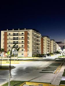 an empty parking lot in front of a large building at Pool Breeze 202 in Punta Cana