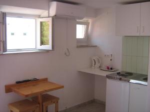 Kuchyňa alebo kuchynka v ubytovaní Linda Apartment