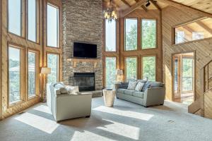 a living room with two couches and a fireplace at 2600 Linden View Drive By Sarah Bernard Vacation Rentals in Innsbrook