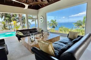 a living room with a couch and a table at Luxury villa located in Montego Bay, Jamaica in Montego Bay