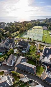 an aerial view of a village with a tennis court at Seaview Cottage in Cardiff