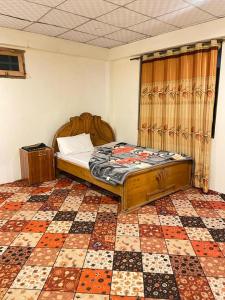 Ένα ή περισσότερα κρεβάτια σε δωμάτιο στο Finger Peak Hotel