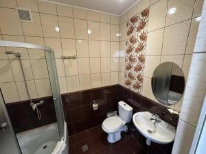 Koupelna v ubytování Готель Цісар