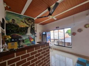 a living room with a painting on the wall at Hotel imperial in Doradal