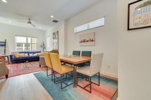 a dining room and living room with a table and chairs at San Antonio Oasis Near Riverwalk and Alamo Park! in San Antonio