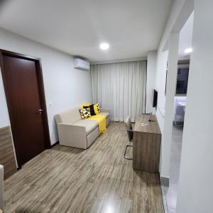 a living room with a couch and a table at Flat Premiere in Rio de Janeiro +22 photos