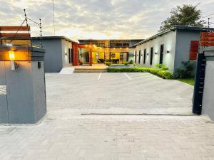 an empty parking lot in front of a building at Signature Boutique Guesthouse in Maun