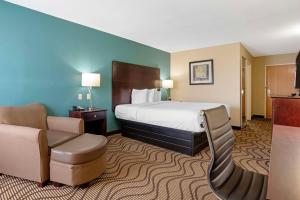 a hotel room with a bed and a chair at Best Western Plus Lonoke Hotel in Lonoke +27 photos