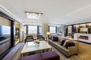 a living room with a couch and a table at Hilton Budapest in Budapest