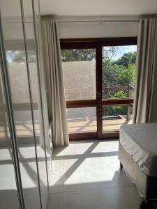 Кровать или кровати в номере Suites Amma Noronha