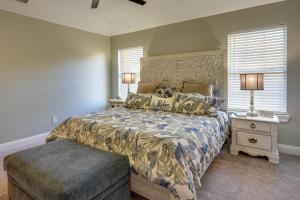 a bedroom with a bed and a nightstand and a window at Family-Friendly PCB Vacation Rental, Walk to Beach in Panama City Beach