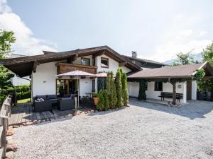 an exterior view of a house with a patio at Kirchberg am Bach in Kirchberg in Tirol