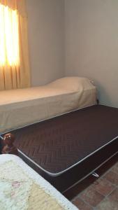 a mattress sitting on the floor in a bedroom at Alquiler temporario Natal, en la entrada a Posadas in Garupá