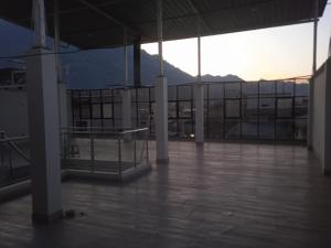 an empty building with a view of a mountain at Los Kristales in Tingo María