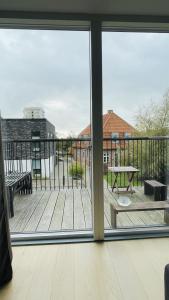 a view of a deck from a window at ApartmentInCopenhagen Apartment 1561 in Copenhagen