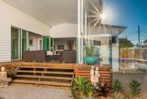 a modern home with a deck and a house at A Perfect Stay - Aditi in Byron Bay