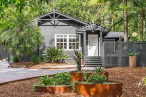 a small house with plants in front of it at A Perfect Stay - Black Star in Byron Bay