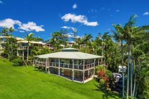an aerial view of a house with palm trees at A Perfect Stay - Cape Breeze in Byron Bay