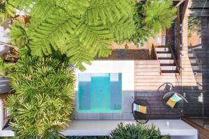 an overhead view of a swimming pool with plants at A Perfect Stay - Clique 3 in Byron Bay