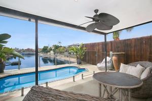 a patio with a pool and a ceiling fan at A Perfect Stay - La Casetta in Gold Coast