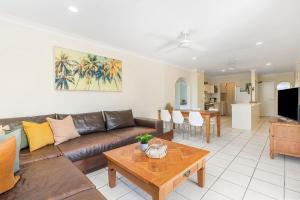 a living room with a couch and a table at A Perfect Stay - Lisas on Lawson in Byron Bay