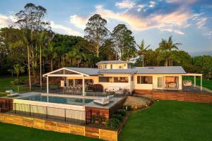 a house with a swimming pool in the yard at A Perfect Stay - Miren Estate in Federal