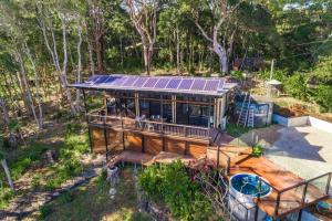 an overhead view of a house with solar panels on it at A Perfect Stay - Ourmuli Cabin in Byron Bay