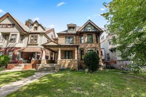 an old house with a stone house at Opulent 2 Bedroom Getaway in Detroit