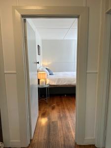 a door leading into a bedroom with a bed at Two Twenty Two Farm Stay in Grassy