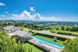 an aerial view of a house with a swimming pool at A Perfect Stay - Villa St Helena in Byron Bay