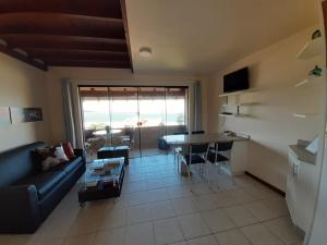 TV a/nebo společenská místnost v ubytování Ap Praia das Cordas