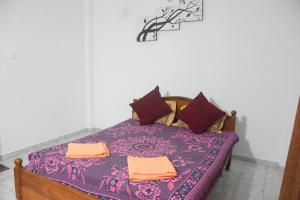 Postel nebo postele na pokoji v ubytování Maharagama Shehan Hotel