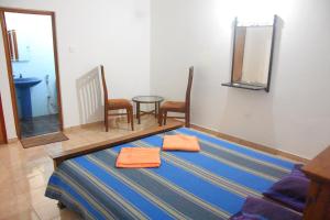 Postel nebo postele na pokoji v ubytování Maharagama Shehan Hotel
