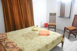 Postel nebo postele na pokoji v ubytování Maharagama Shehan Hotel