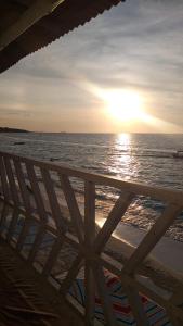 a view of the ocean at sunset from the beach at baru express in Cartagena de Indias