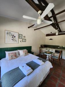 a bedroom with a bed and a ceiling fan at The Lavender Patch in Mundaring