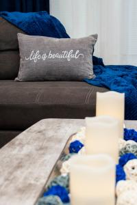 a couch with a pillow with the words life is beautiful at Mint2Stay Suite in Portsmouth