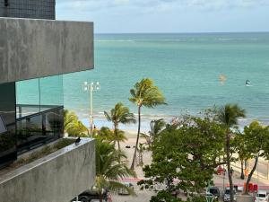 a view of the beach from a building at Apartamento em Maceió com beira mar in Maceió
