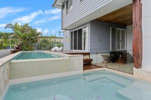 a swimming pool in the backyard of a house at A Perfect Stay - The Beach House in Lennox Head