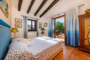 Postel nebo postele na pokoji v ubytování Es Turonet + 37 fotografií