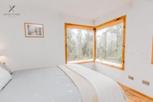A bed or beds in a room at Hotel Fundo Las Tortolas