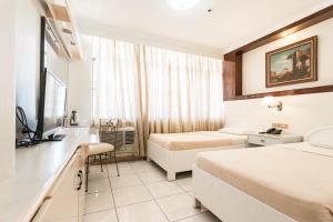 Voodi või voodid majutusasutuse Hotel Canelsa toas