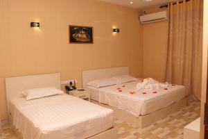 Postel nebo postele na pokoji v ubytování Nilawin Hotels & Resorts