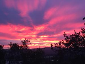 The sunrise or sunset as seen from a szállodákat or nearby